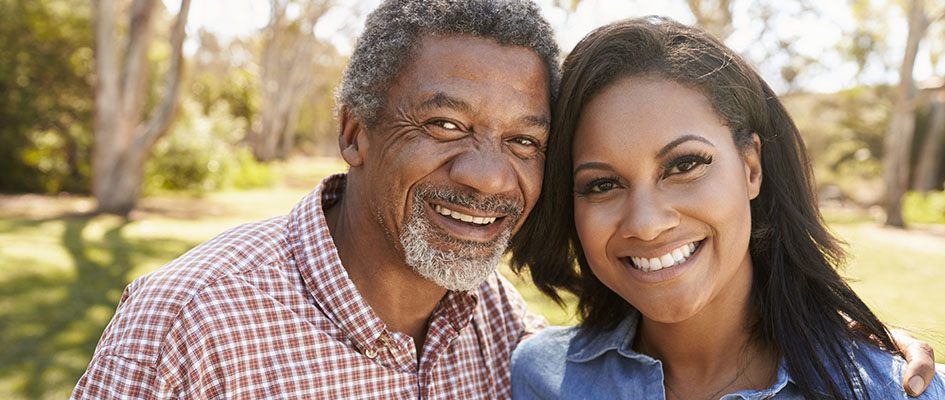 portrait of dad and daughter smiling