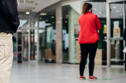 woman long-distance standing in queue