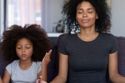 mother and daughter meditating