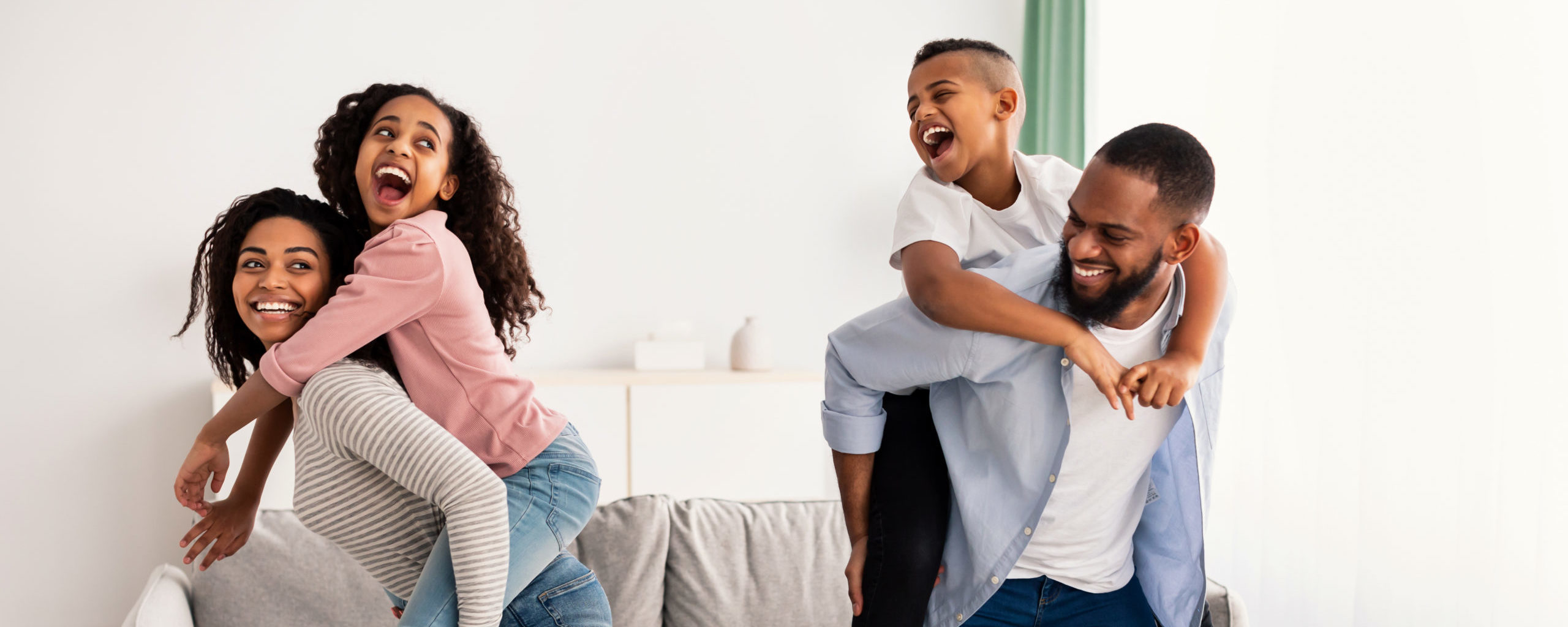 Portrait of a happy black family having fun at home