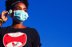 Young black woman wearing protective mask