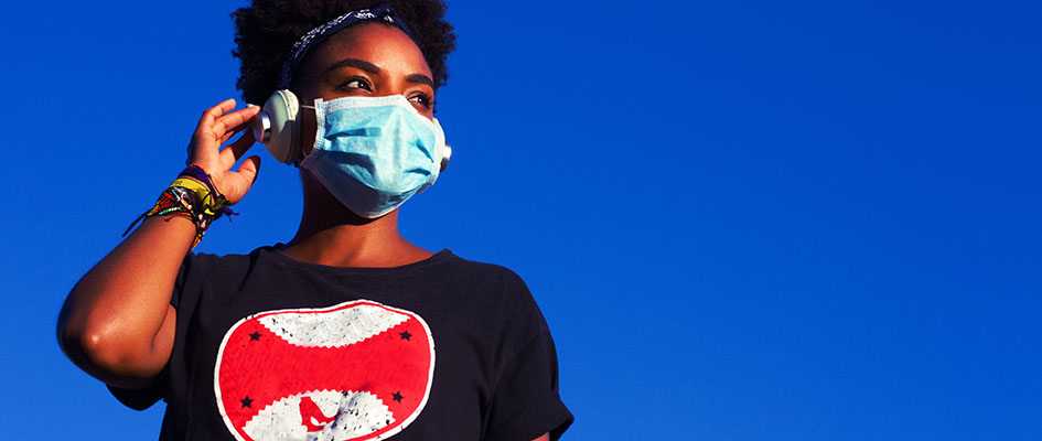 Young black woman wearing protective mask